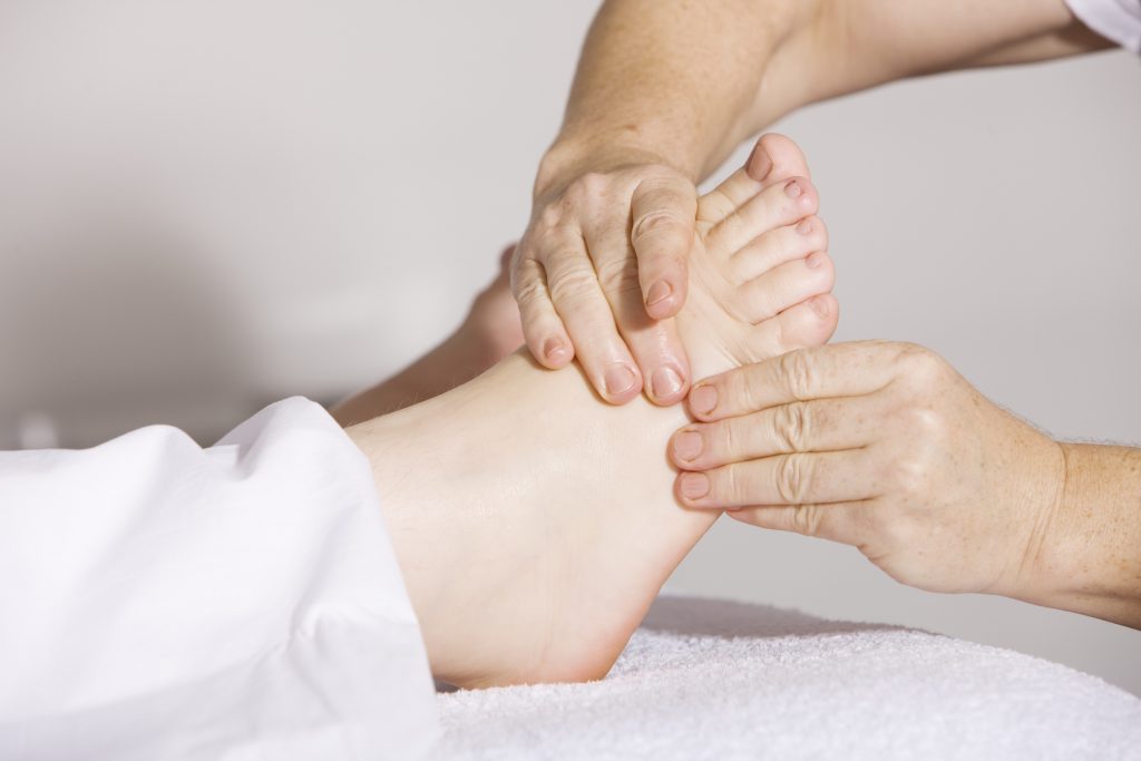 Doctor giving patient a physical exam